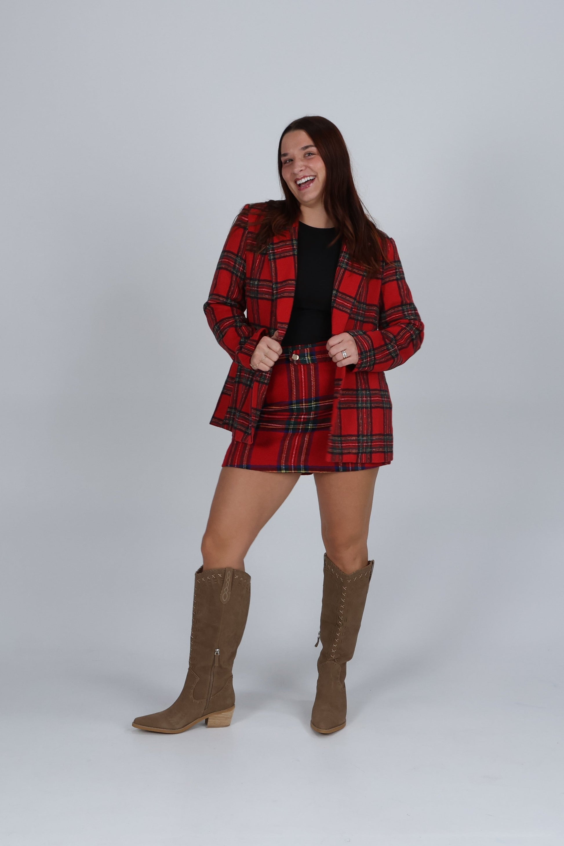 “Plaid tailored shorts styled with matching blazer — chic coordinated winter outfit.”